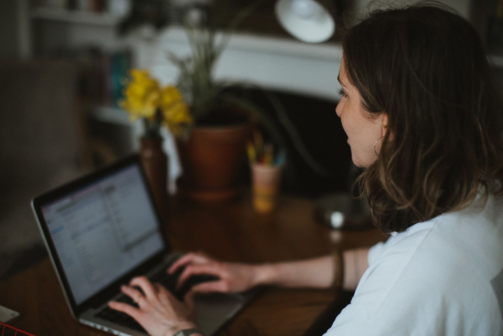 business coach and copywriter works at her laptop.